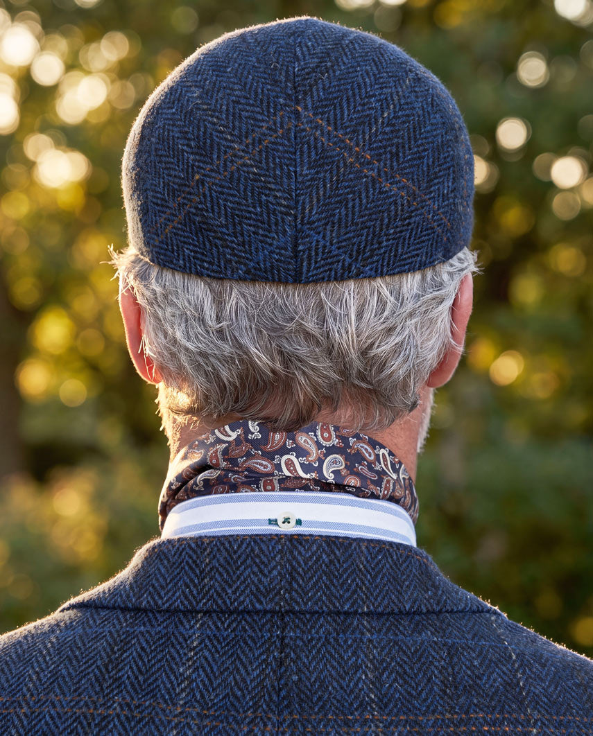 Schiebermütze "Henry Cap" aus original Harris Tweed in dark blue herringbone