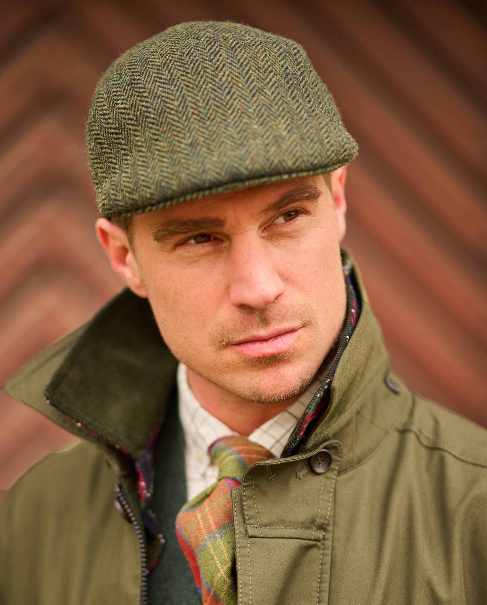 Harris Tweed Mütze "Henry Cap" in green island herringbone - Wellington of Bilmore