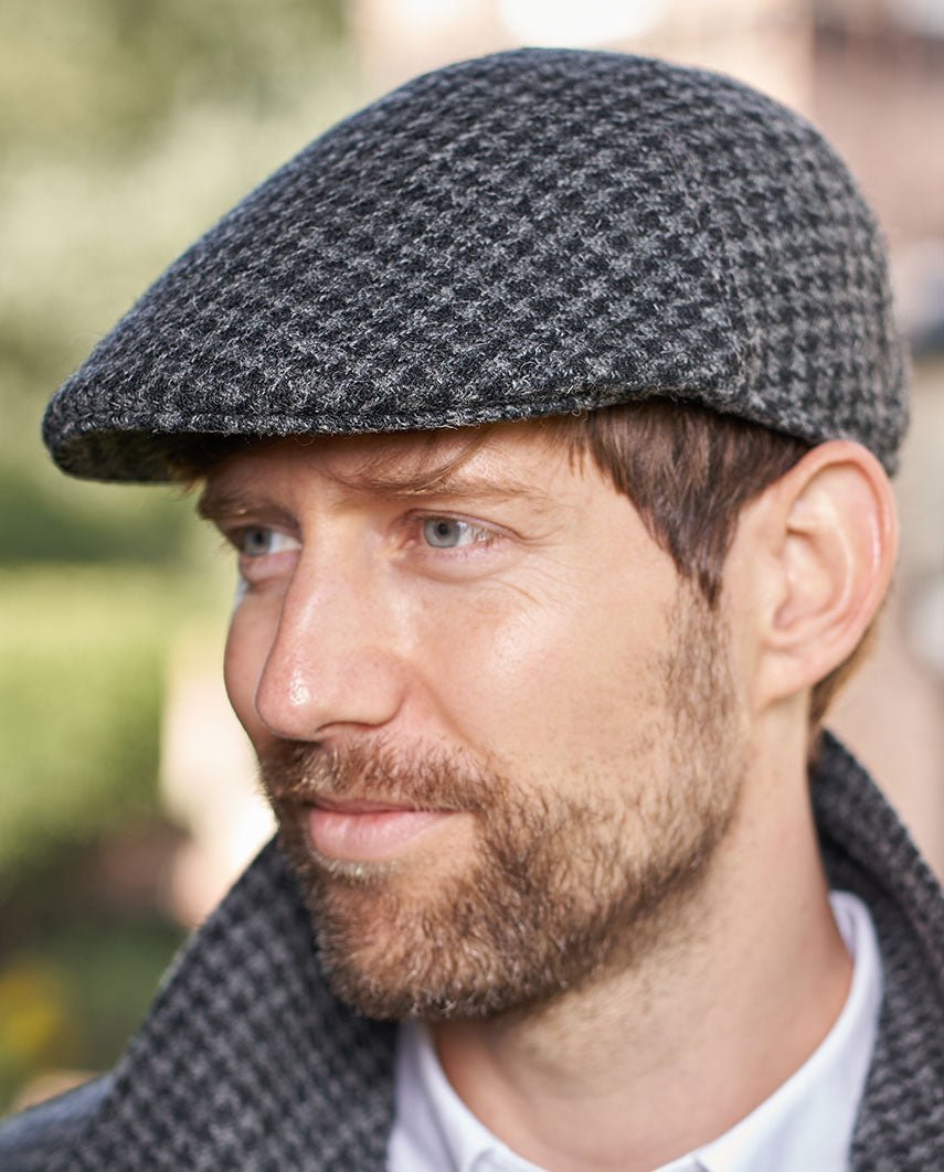 Harris Tweed Mütze "Henry Cap" in black houndstooth - Wellington of Bilmore