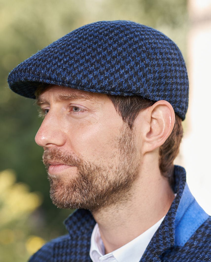 Harris Tweed Mütze "Henry Cap" in blau - schwarzem Hahnentritt - Wellington of Bilmore